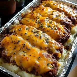 cheesy meatloaf over mashed potatoes